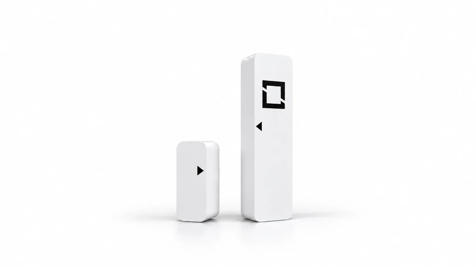 Garage Guardian door sensor and its magnet, two white peel-and-stick pieces